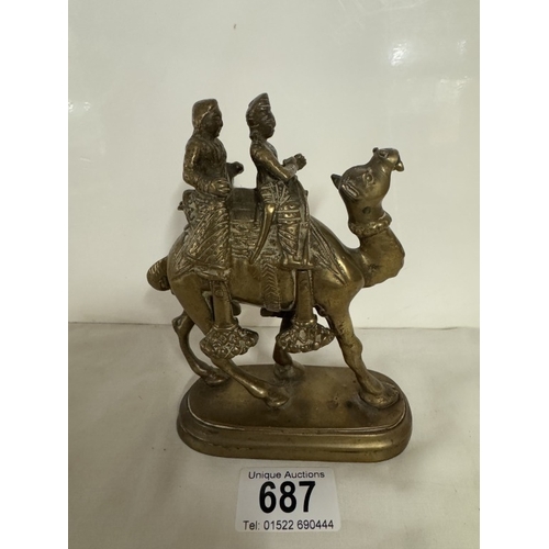 687 - A vintage brass camel with 2 riders, height 14.5cm, base 11cm x 5cm