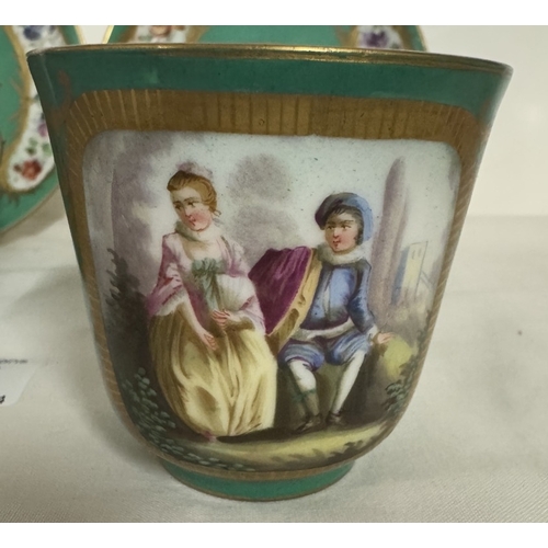 688 - A pair of 18th century French Sevres porcelain cups & saucers portraying courting couples