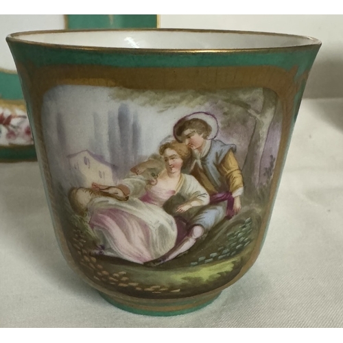 688 - A pair of 18th century French Sevres porcelain cups & saucers portraying courting couples