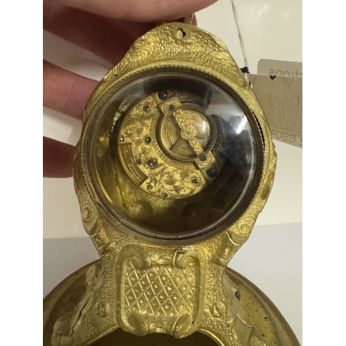 693 - A gilt ormolu clock with verge movement by Thos Whitfield with glass covered escape, height 18cmment