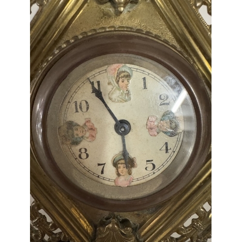 694 - A diamond shaped brass clock