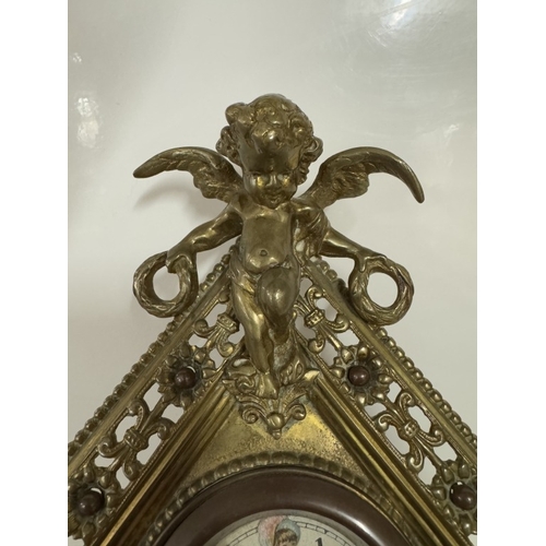 694 - A diamond shaped brass clock