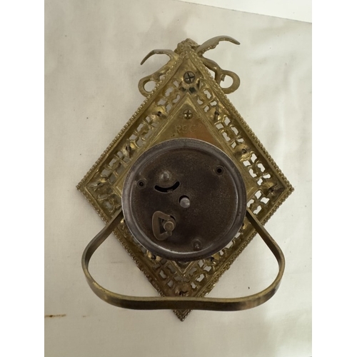 694 - A diamond shaped brass clock