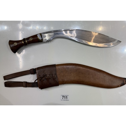 711 - A kukri & scabbard, marked on blade 1917