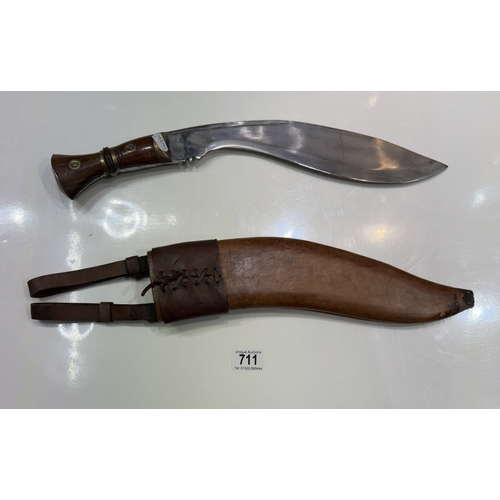 711 - A kukri & scabbard, marked on blade 1917