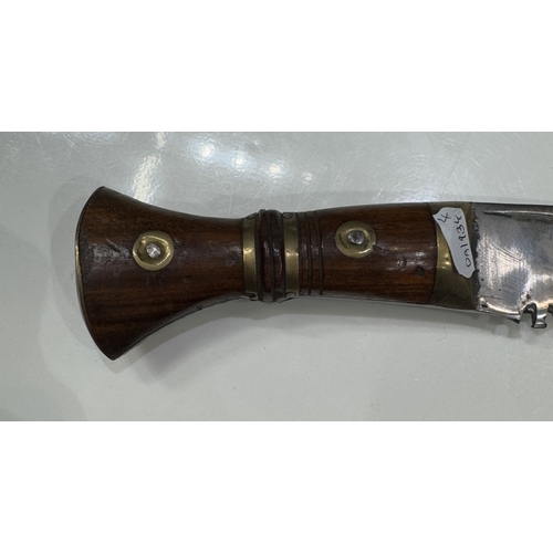 711 - A kukri & scabbard, marked on blade 1917