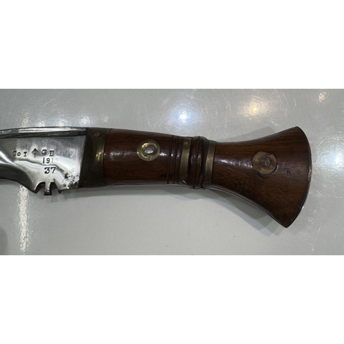 711 - A kukri & scabbard, marked on blade 1917