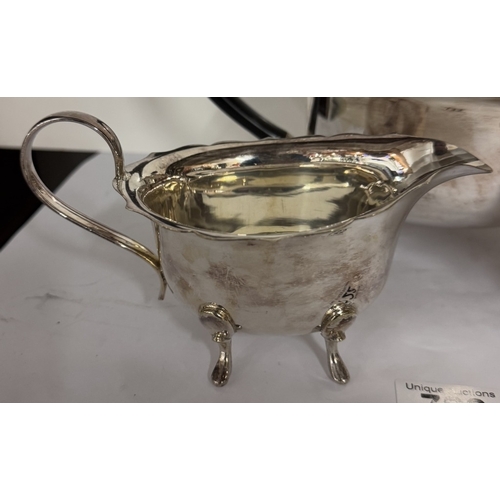 722 - A 3 piece silver plate teapot, sugar bowl & milk jug