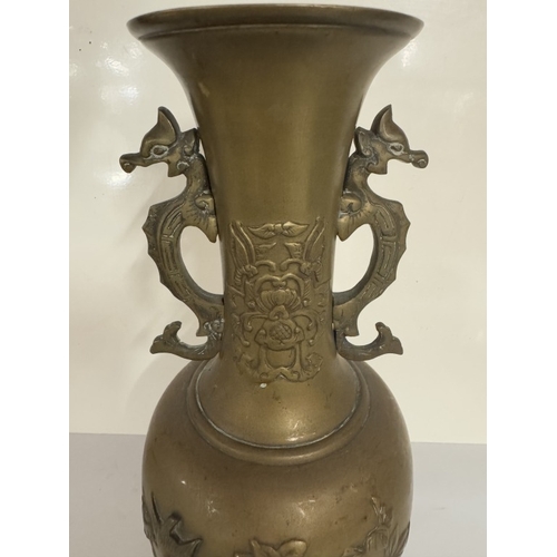 730 - A pair of bronze urns