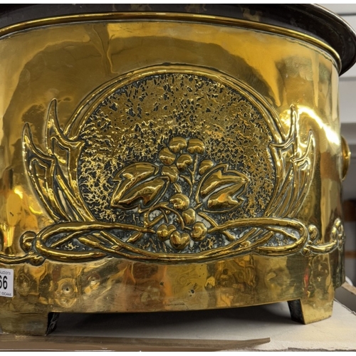 766 - A large heavy brass log bin with art nouveau decoration