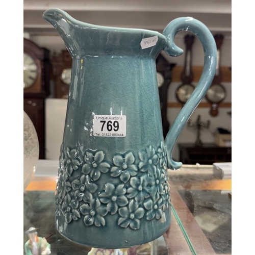 769 - A blue glazed ceramic jug