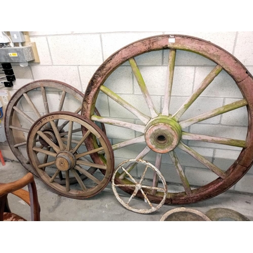 1505 - 3 large wooden cart wheels & a smaller metal wheel