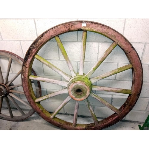 1505 - 3 large wooden cart wheels & a smaller metal wheel