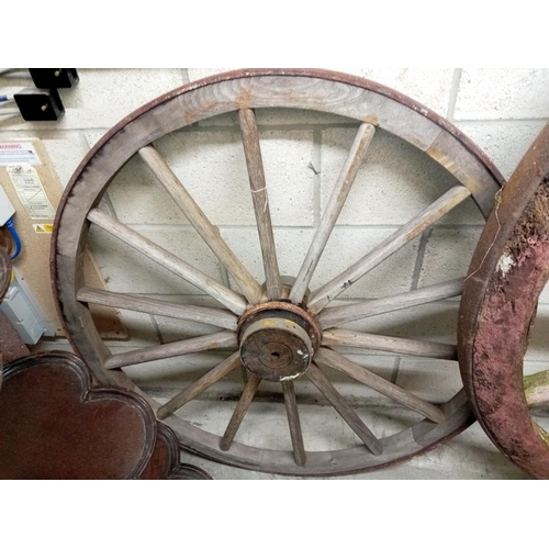 1505 - 3 large wooden cart wheels & a smaller metal wheel