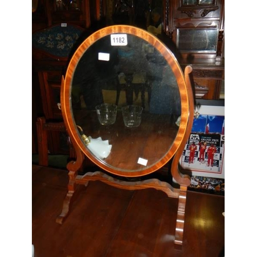 1182 - An oval mahogany inlaid toilet mirror.