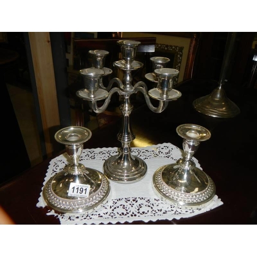 1191 - A silver plate candelabra and a pair of silver plate candlesticks.