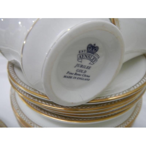 1193 - Approximately 45 pieces of Aynsley Jubilee Gold dinner ware.