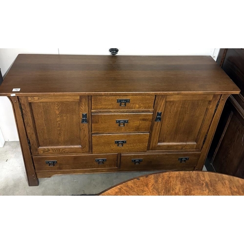 792 - An arts & crafts influenced oak sideboard