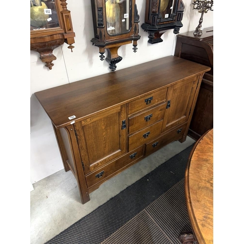 792 - An arts & crafts influenced oak sideboard