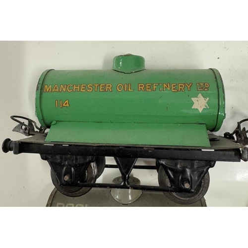 869 - 4 Hornby O gauge fuel tankers including Pool, National & Mobil Oil