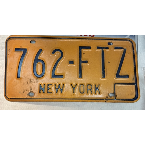 1664 - A quantity of USA number plates