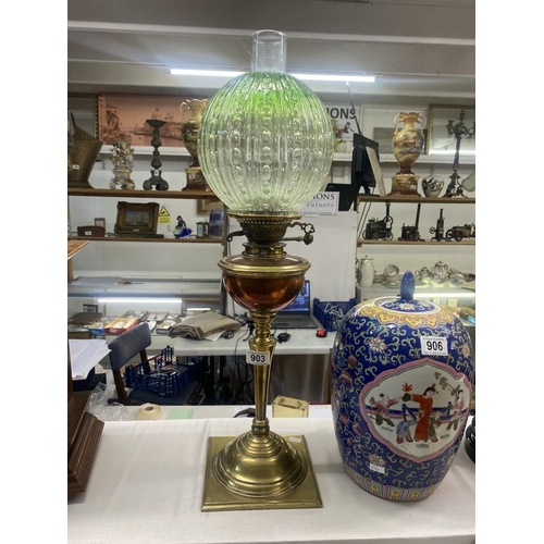 903 - A Victorian brass & copper oil lamp with green glass shade