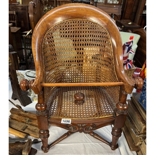 1696 - A vintage child's Bergere wing armchair with spare finial