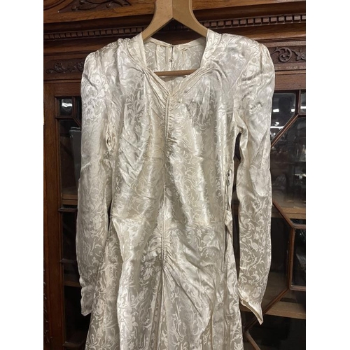 778 - A 1940's wedding dress embossed rayon with train