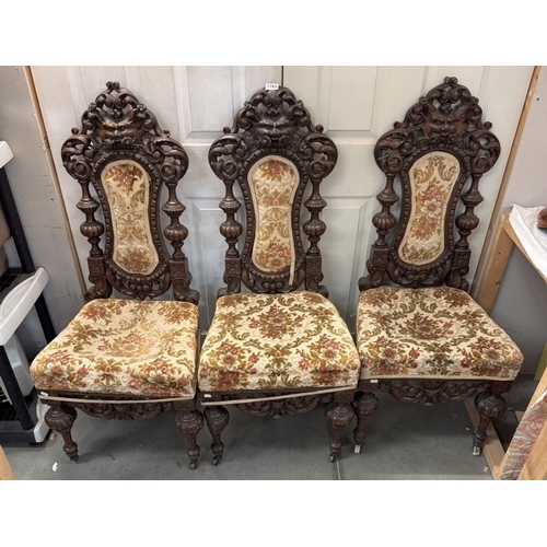 1765 - A set of 3 19th century heavily carved hall chairs