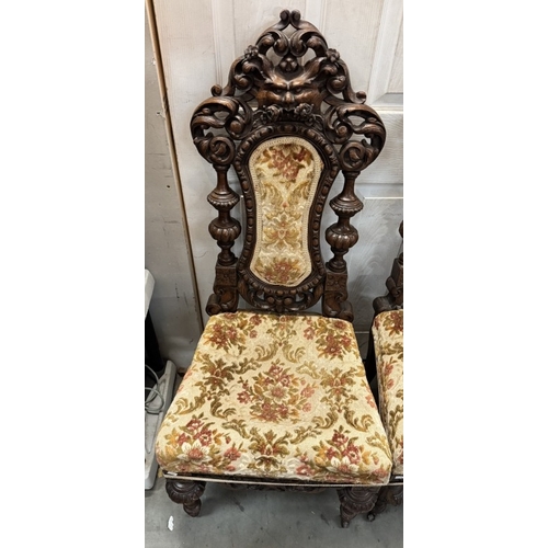 1765 - A set of 3 19th century heavily carved hall chairs