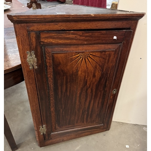 1770 - A 19th century corner cupboard with star inlay to door