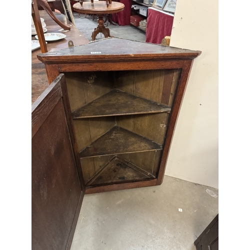 1770 - A 19th century corner cupboard with star inlay to door