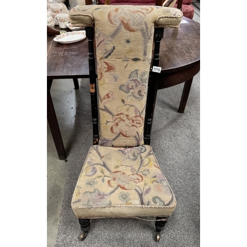 1776 - A 19th century high back nursing chair with wool work upholstery