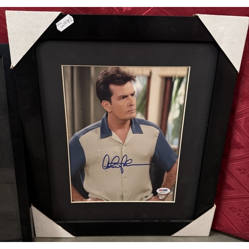 1783 - 2 Framed & glazed Charlie Sheen signed photographs