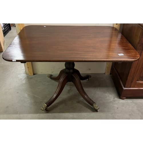 1822 - An Edwardian mahogany tip up tea table on centre column