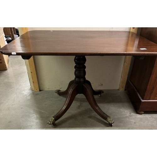 1822 - An Edwardian mahogany tip up tea table on centre column