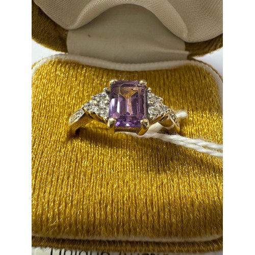 76 - A 9ct gold amethyst ring with diamond shoulders, size O, 2.12 grams.