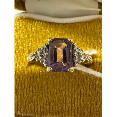 76 - A 9ct gold amethyst ring with diamond shoulders, size O, 2.12 grams.