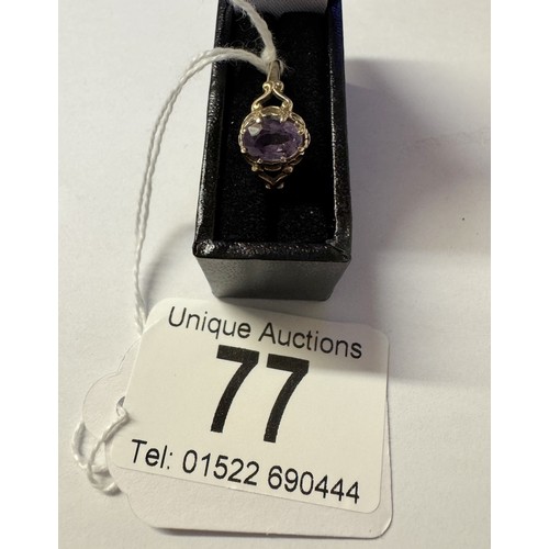 77 - A 9ct gold amethyst ring with fancy shoulders, size P, 1.4 grams.