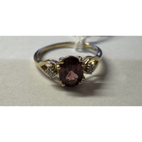 78 - A 9ct gold ring set red stone with diamond shoulders, size R, 2.3 grams.