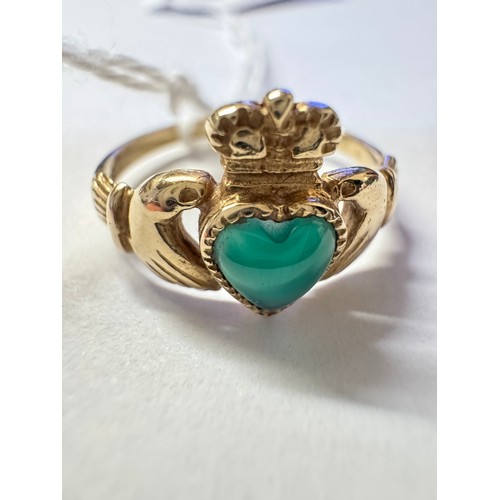 80 - A 9ct gold Irish Claddagh ring set with a green stone, size M, 1.5 grams.