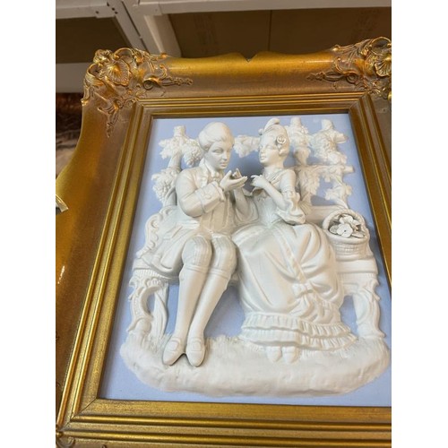 277 - A superb gilt framed bisque porcelain plaque featuring a romantic couple.