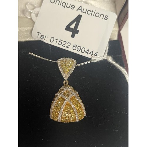 4 - A 9ct gold double diamond pendant on a 9ct chain, 3.99 grams