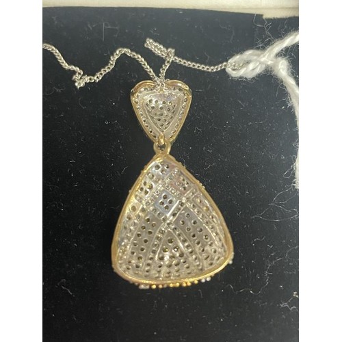 4 - A 9ct gold double diamond pendant on a 9ct chain, 3.99 grams