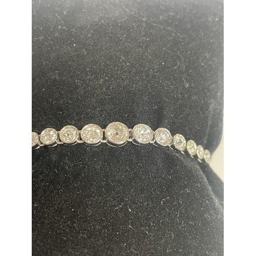 13 - A three carat plus 18ct white gold diamond bracelet, 7.49 grams.