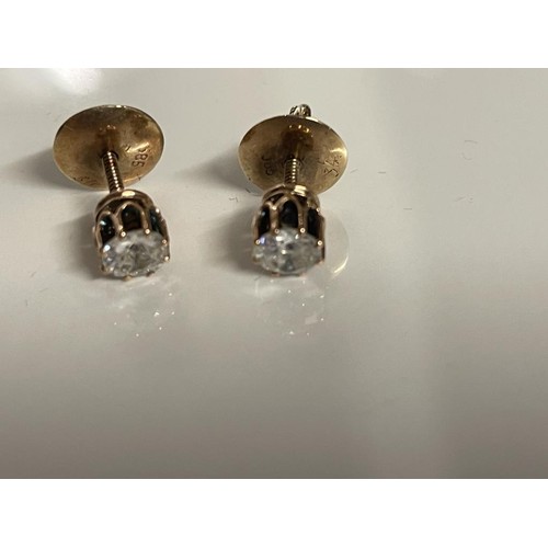 36 - A pair of 9ct gold and diamond stud earrings.