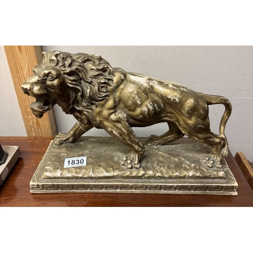 1830 - A resin sculpture of a lion.