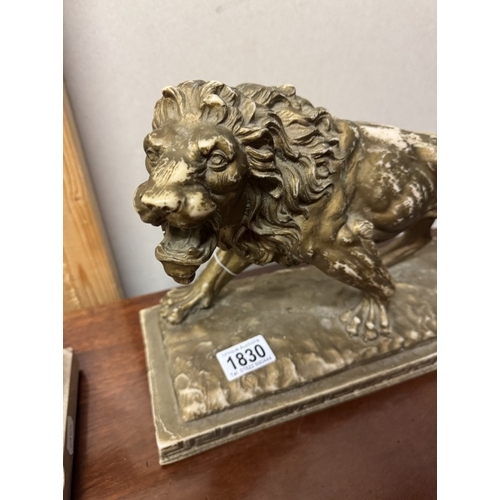 1830 - A resin sculpture of a lion.