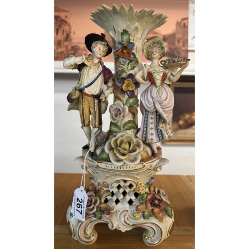 267 - A 19th century porcelain vase supported by male and female figures (needs a good clean).