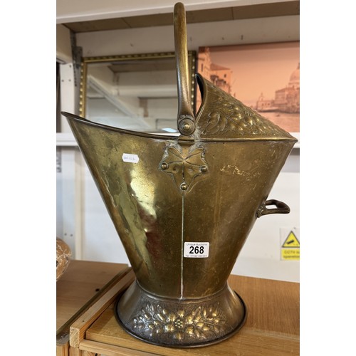 268 - A good old brass helmet shaped coal scuttle.